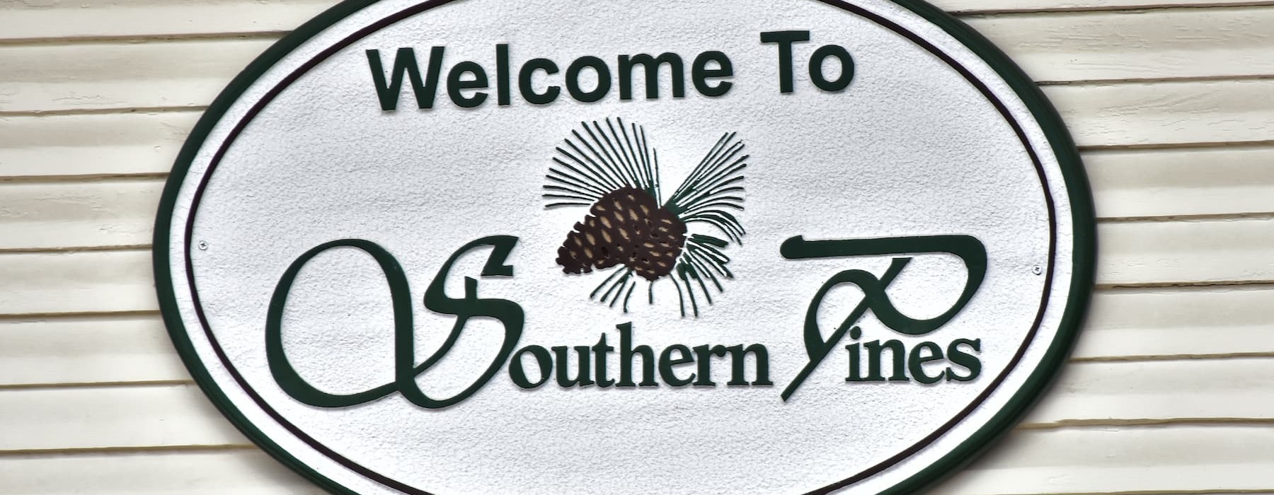 a local sign that ways welcome to southern pines